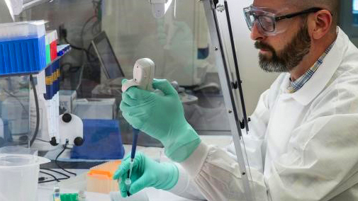 A CDC scientist implements molecular testing to test for different types of polio. CDC PHIL photo: James Gathany. A CDC scientist implements molecular testing to test for different types of polio. CDC PHIL photo: James Gathany.
