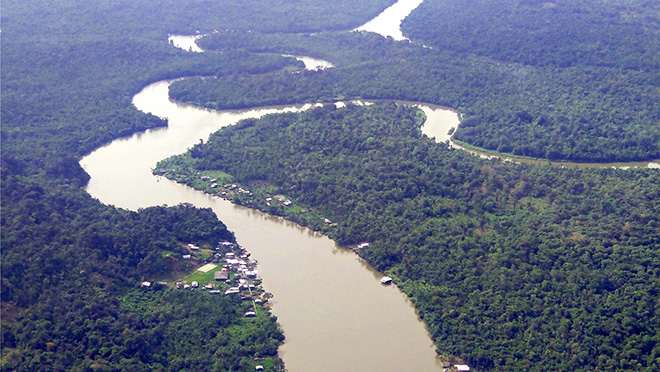 Localities-Cauca-Colombia-by-Raul-Pardo Arial view of the Cauca region, showing a winding river and a heavily forested area.