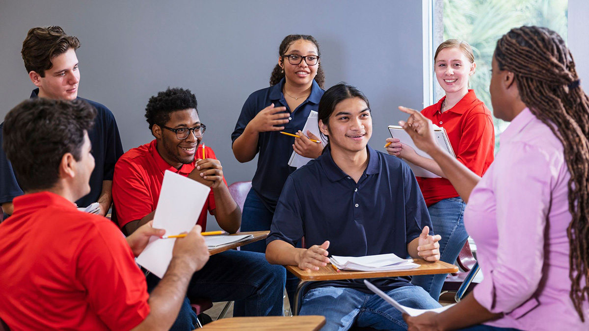 Teenage boys Teacher, high school students having group discussion