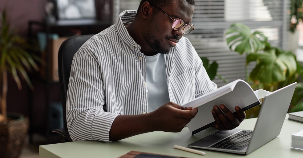 Student reviewing a research paper before submitting