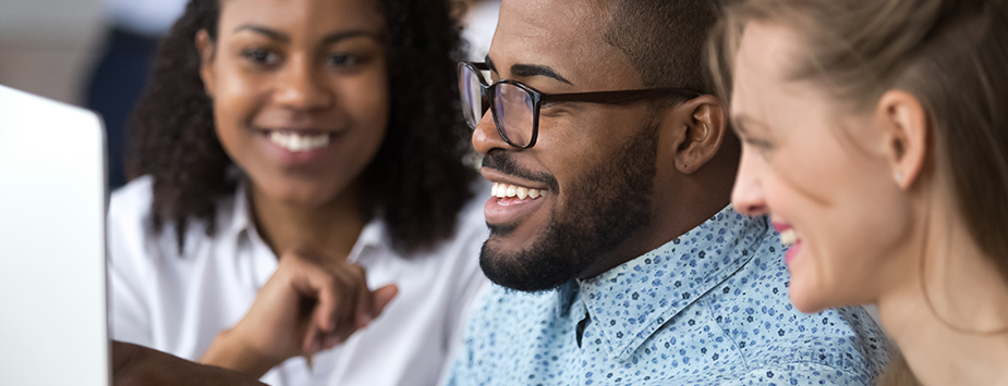 Applications Open for CDC’s Public Health Law Fellowship Three early career adults looking into the laptop monitor.