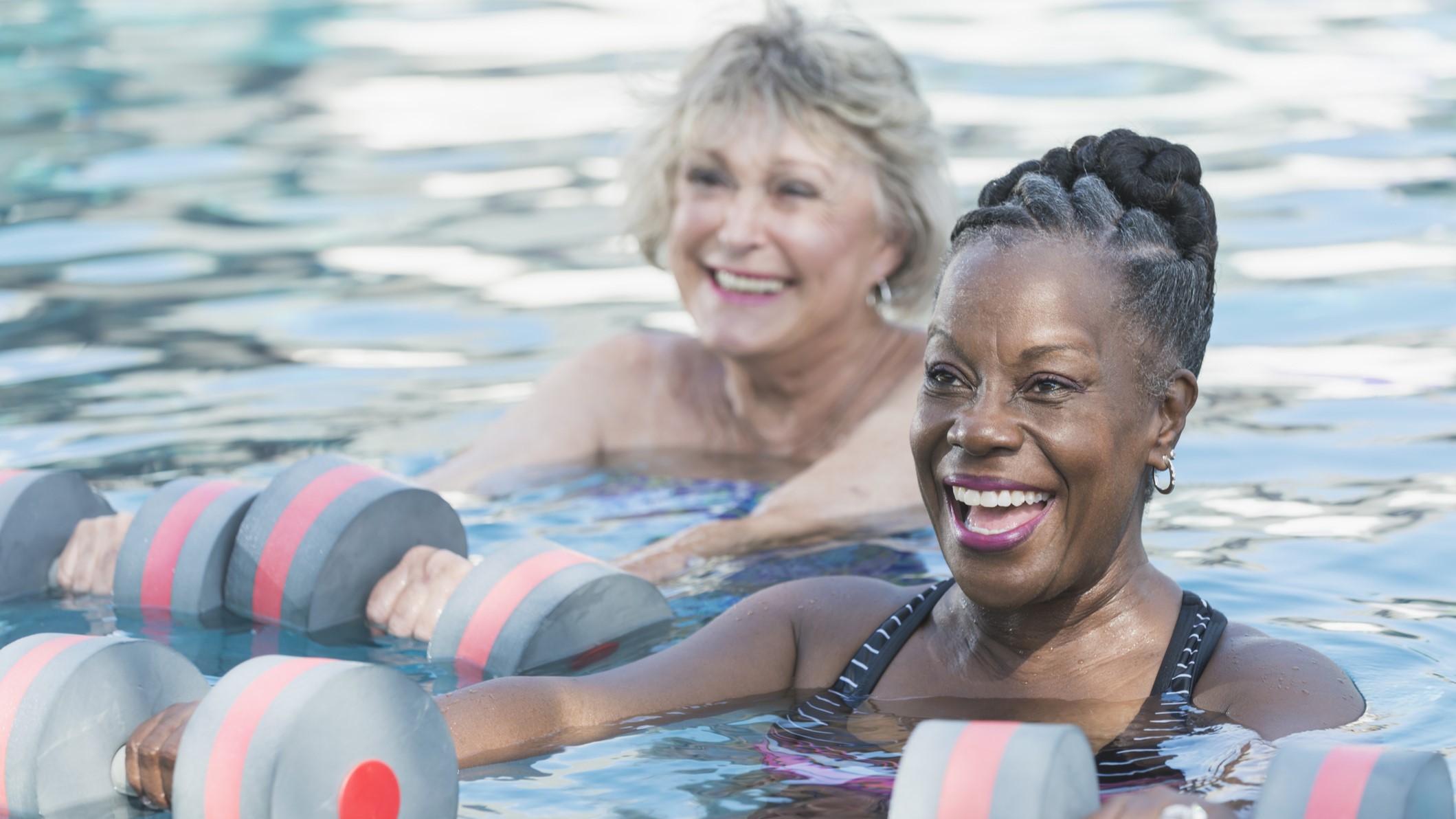 — title missing — Senior black woman and friend doing water aerobics