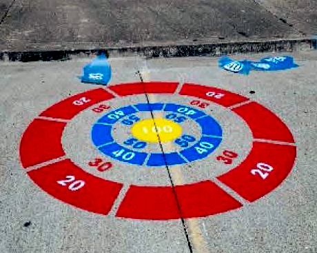 painted_play_space Colorful bullseye target game painted on the sidewalk.