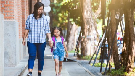 — title missing — Mother and daughter walking.
