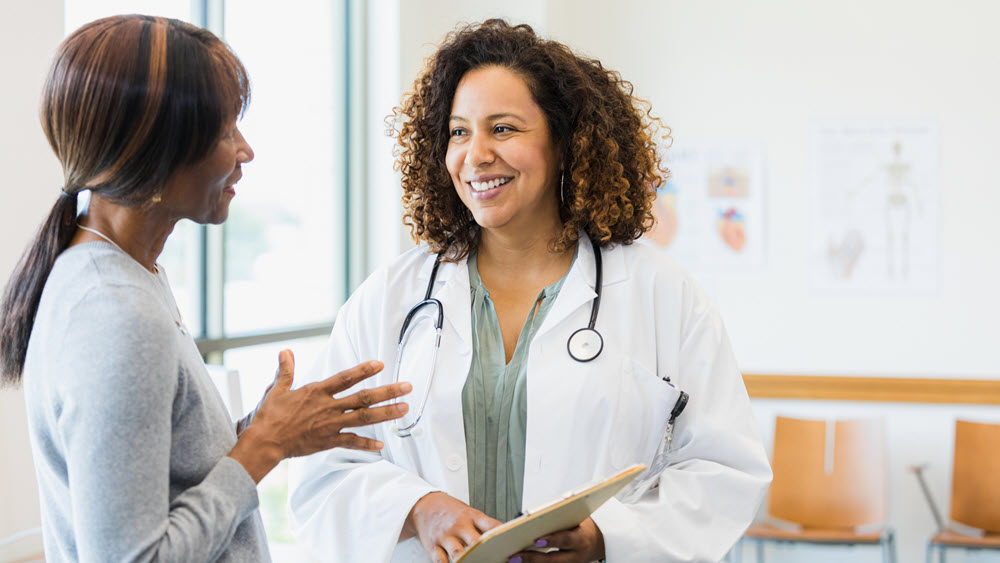 Woman talks with a healthcare provider Woman talks with a healthcare provider