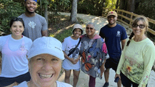 Healthy Savannah A group of people taking a selfie photo outside.