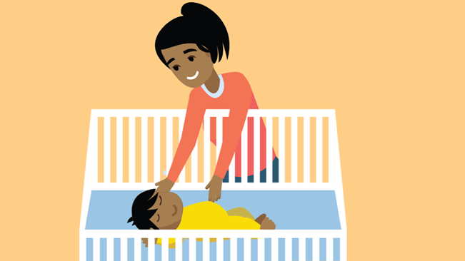 Mother putting baby in crib Mother laying baby to sleep on back in an empty crib