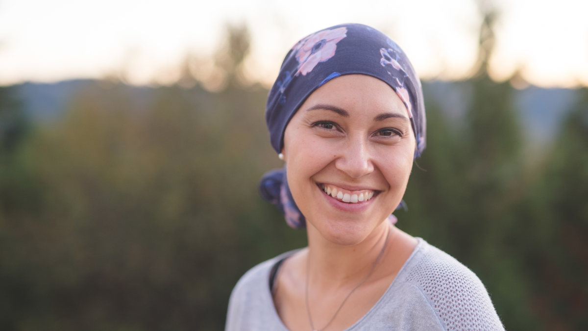 Woman with headscarf White young woman wearing a purple scarf on her head, concealing hair loss.