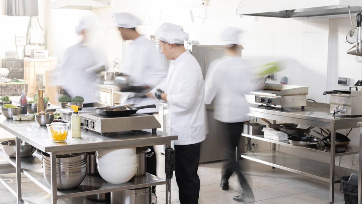 Resources for restaurants Photograph of food workers in a kitchen.
