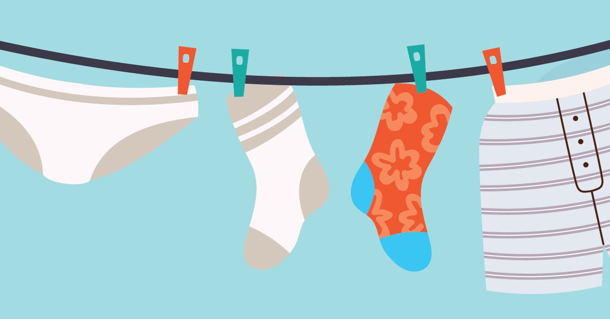 Clean socks and underwear underwear and socks hanging on a clothesline.
