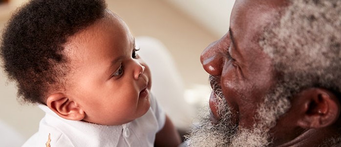 Grandfather holding baby_crop Grandfather holding baby