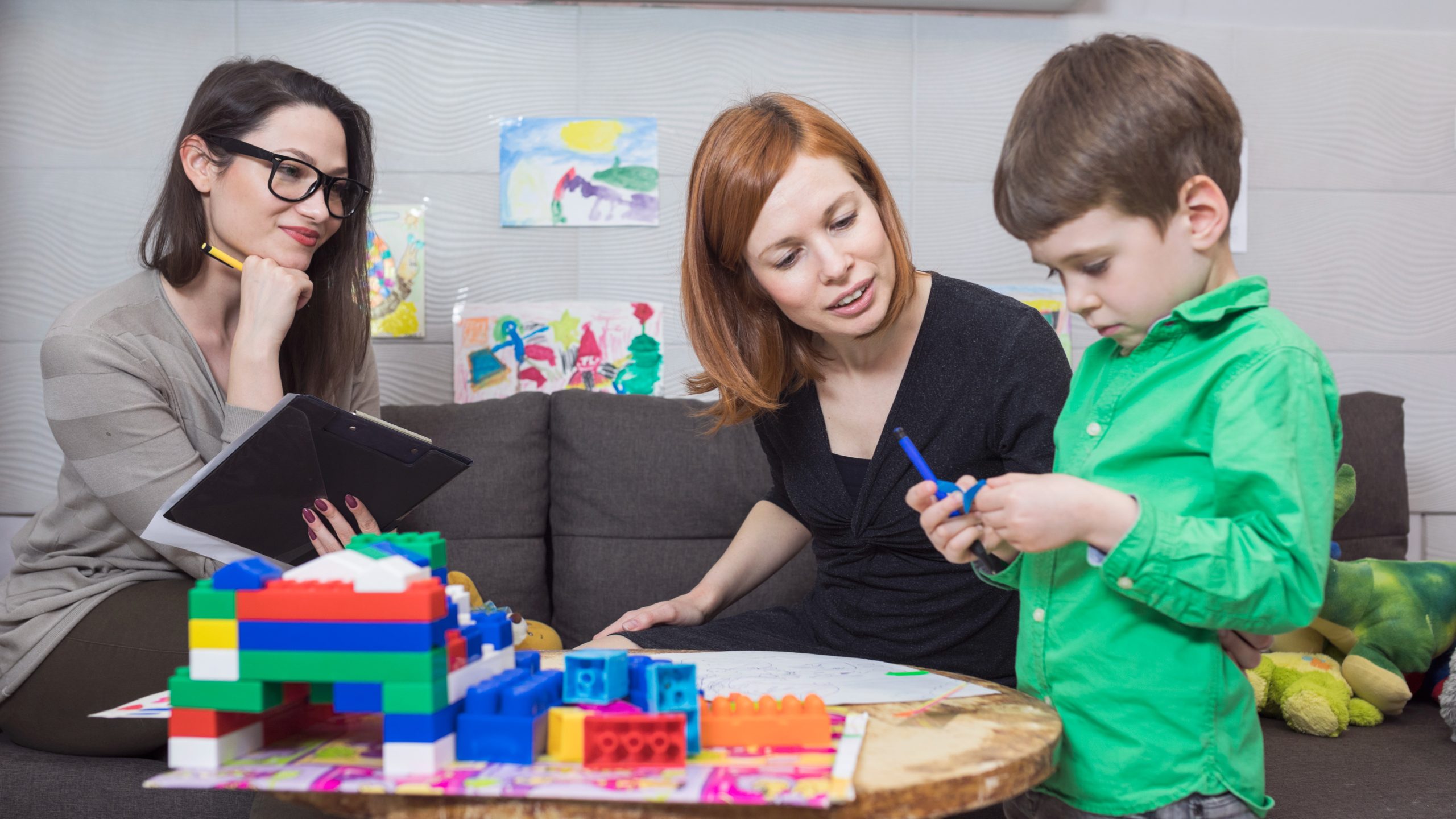Child Psychologist at Work Child Psychologist at Work with a child and parent