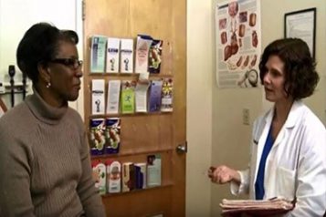 — title missing — A doctor talks to a patient.