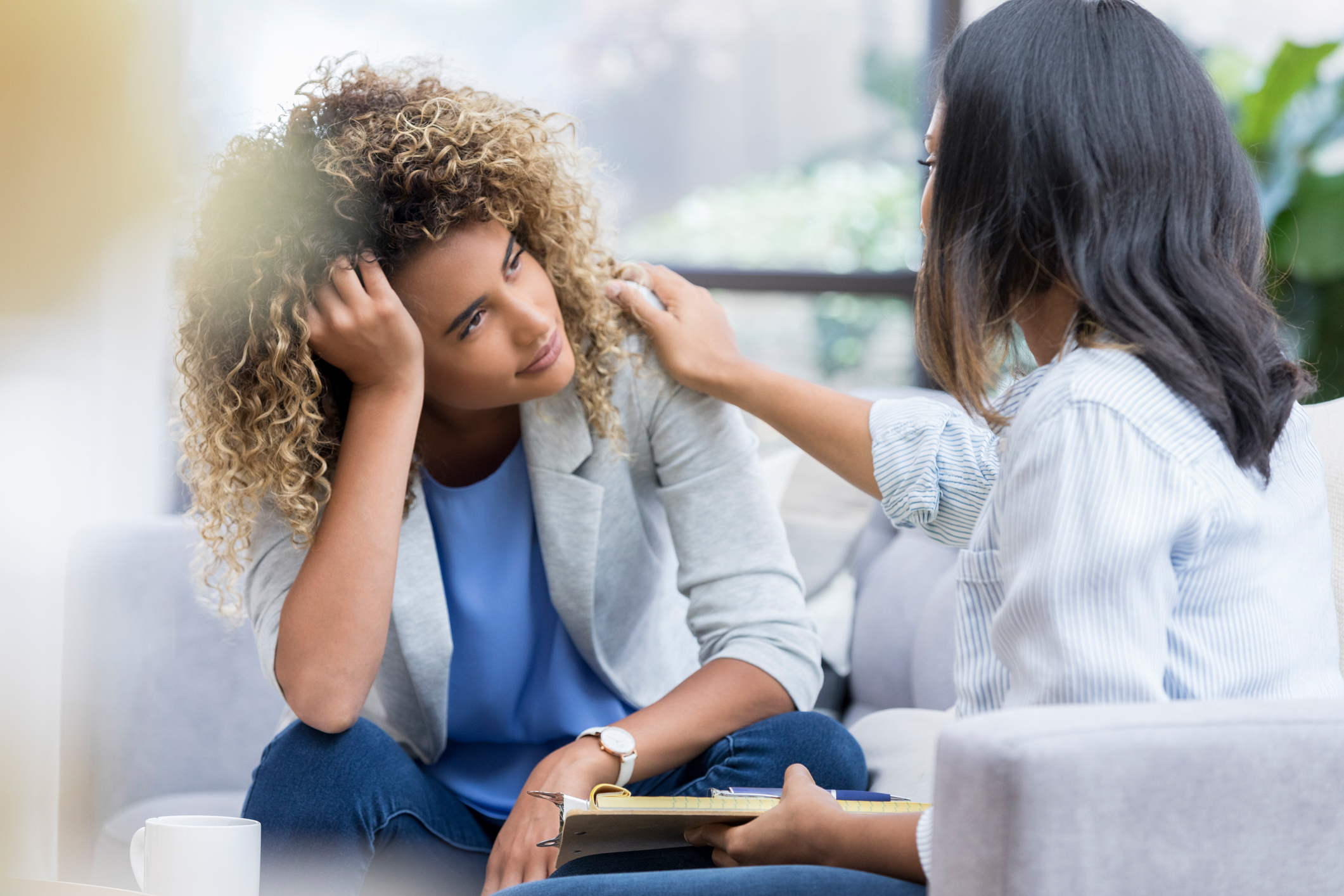Sad woman speaking to heath care provider Sad woman speaking to heath care provider