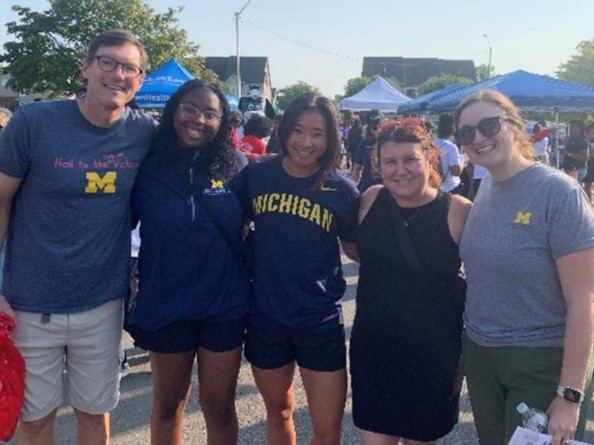 MI SCDC at SCDAA walk Five persons in athleticwear pose together outdoors
