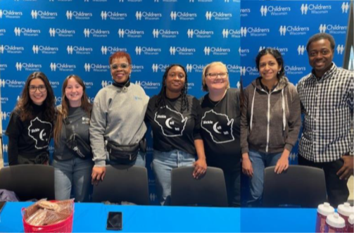 WI SCDC blood drive Seven people stand together in front of a Children's Wisconsin backdrop