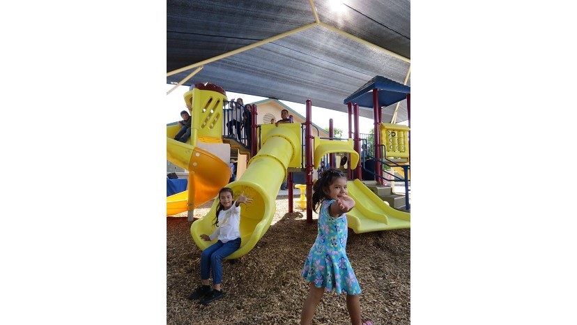 Shading Children Children playing under a shade structure funded by the American Academy of Dermatology