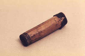 Variolation A small brown, cylindrical container