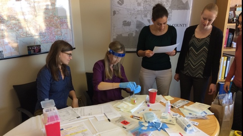EEP_Suspect-urine-culture four women running a urine test