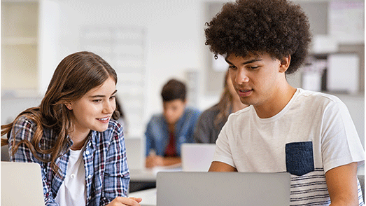 on-line-summer-course a girl and boy staring at a laptop