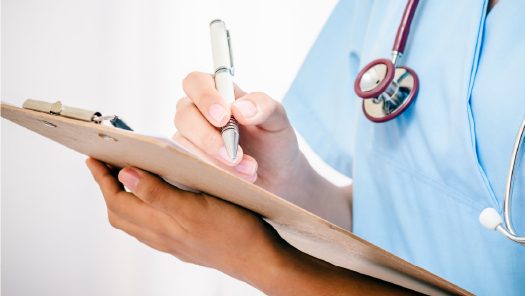 doctor with clipboard photo of doctor with clipboard
