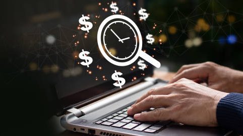 person researching money on laptop