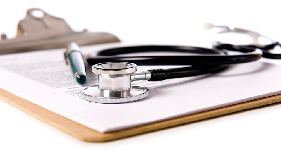 — title missing — Clipboard with stethoscope on top