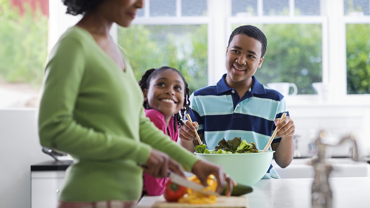 A family in the kitchen.