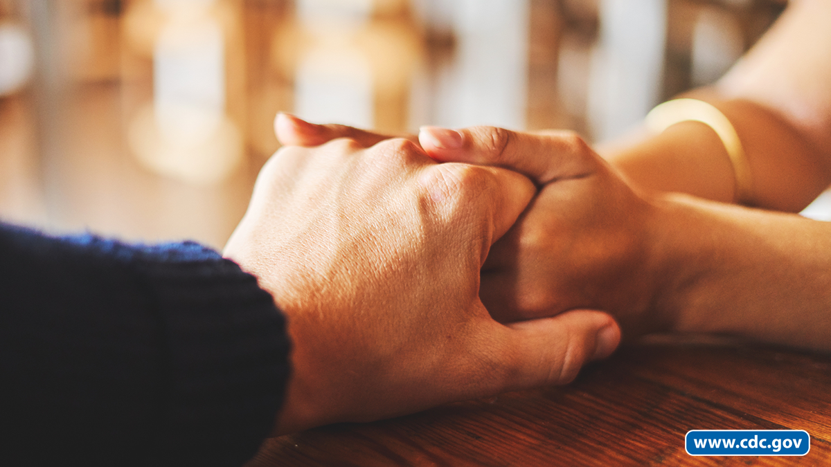 Two people holding hands Two people holding hands