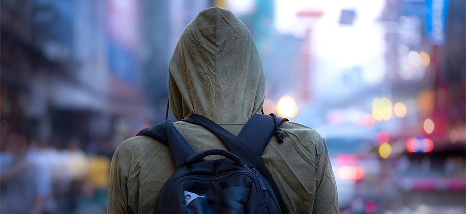 person wearing hoodie with a backpack person wearing hoodie with a backpack