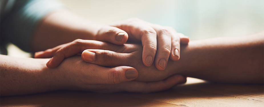 nowcasting-header-hands_925x375 hands holding on table