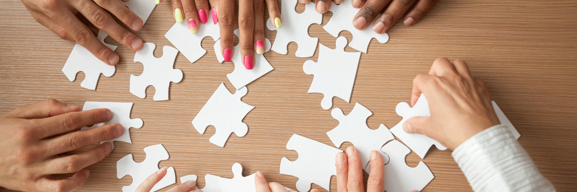 making-puzzle-1124x375 people working on a puzzle