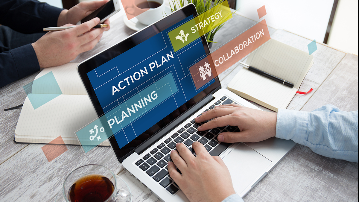 News and Spotlight for Flu. A person typing on a laptop. The laptop screen says, "Action Plan" Planning" "Strategy" and "Collaboration."