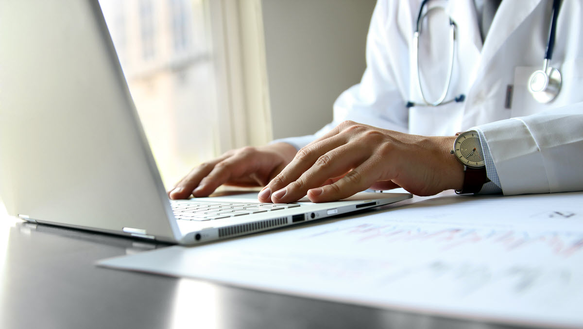 Health care provider working on computer Doctor working on a computer