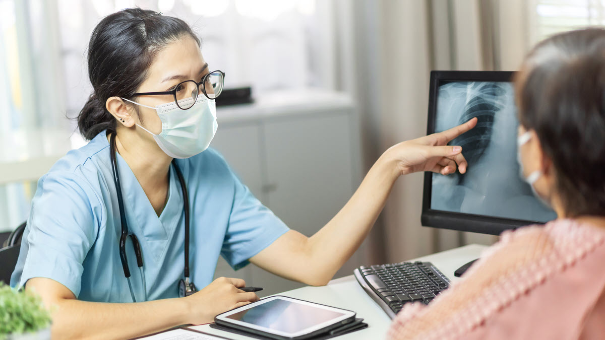 Health care provider reviewing xray with patient Health care provider reviewing xray with patient
