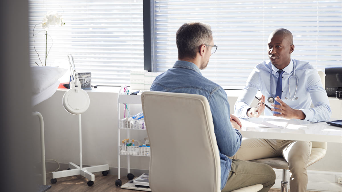 Doctor with patient Photo of a doctor with his patient