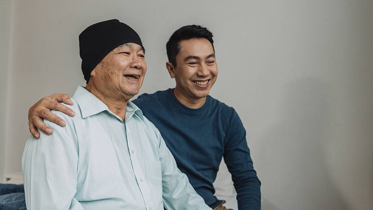 cdc-osh-family-generations Father, a cancer patient, enjoys talking with his son.