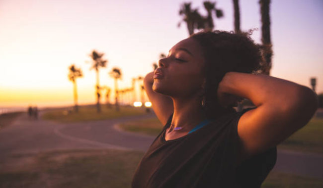 image.png Woman relaxing by taking deep breath.