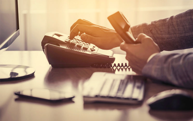 quitline-quest10-1 How can I learn more about quitlines? Person dialing a phone.