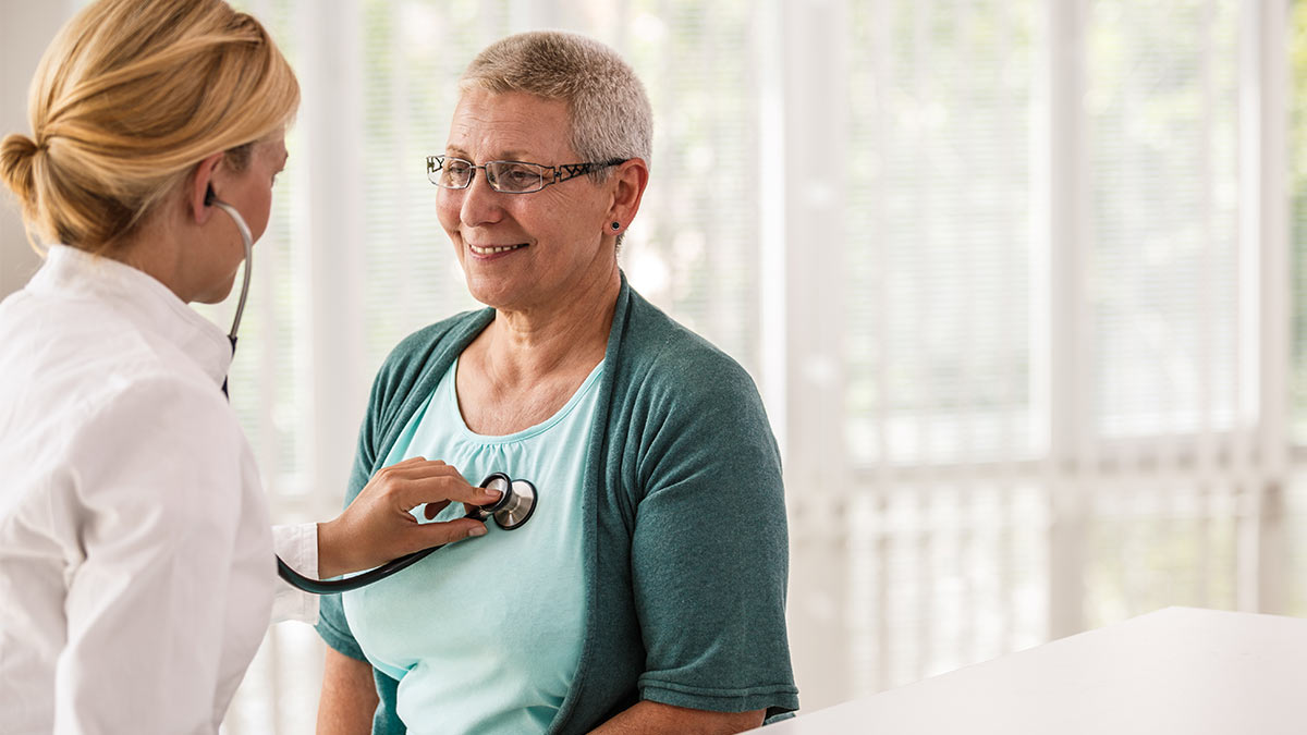 Health Benefits Quitting Smoking Doctor examining patient using a stethoscope.