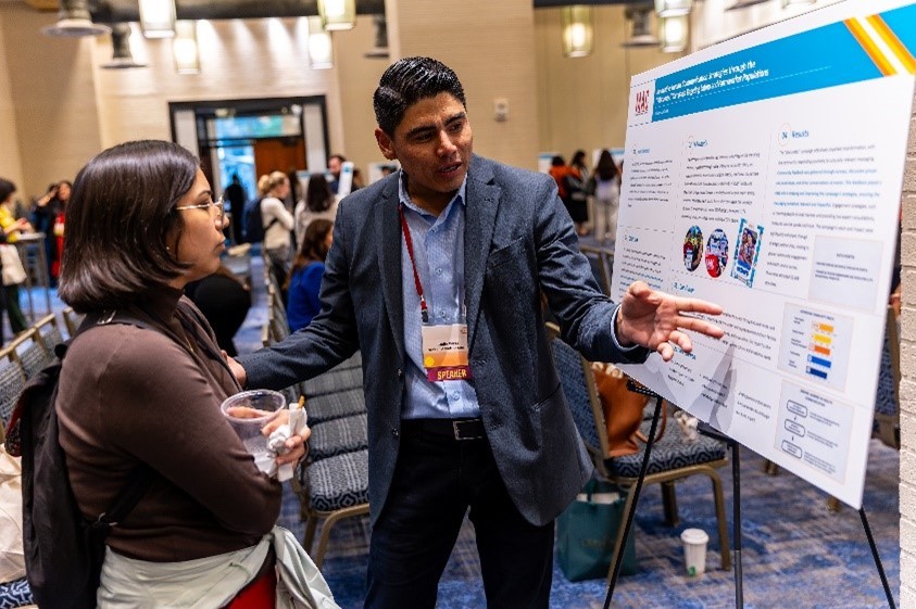 UnidosUS’ outreach efforts helped to bridge vaccine access gaps in Latino communities. A UnidosUS affiliate presents a poster highlighting vaccine outreach efforts at the 2024 EHFA Vaccine Program Convening.