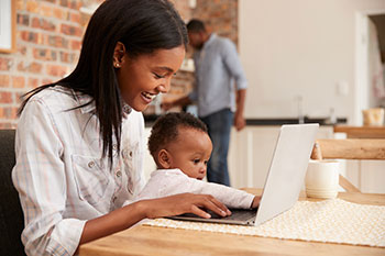 mom with laptop and baby Mom with laptop and baby