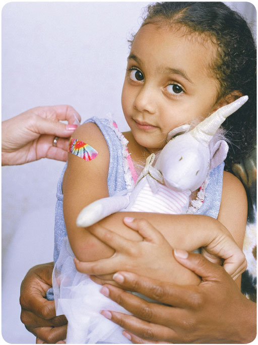 vacc-confidence-girl Girl holding a stuffed animal