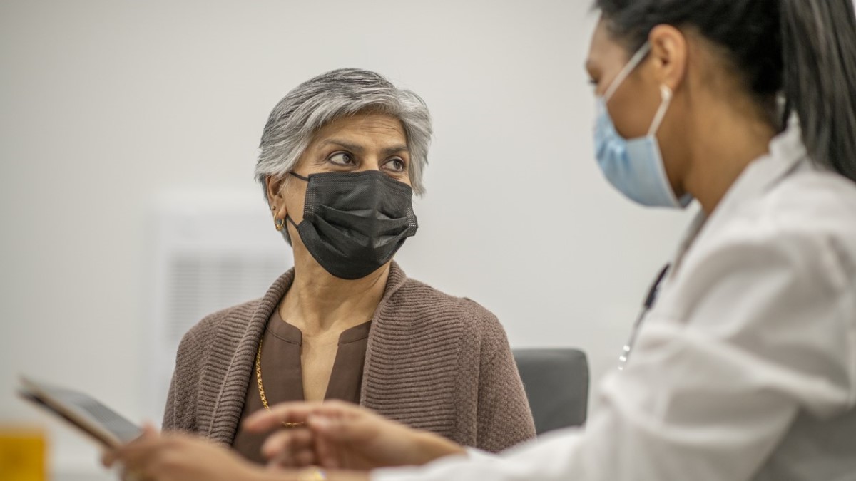 Doctor Patient a woman talking to her doctor