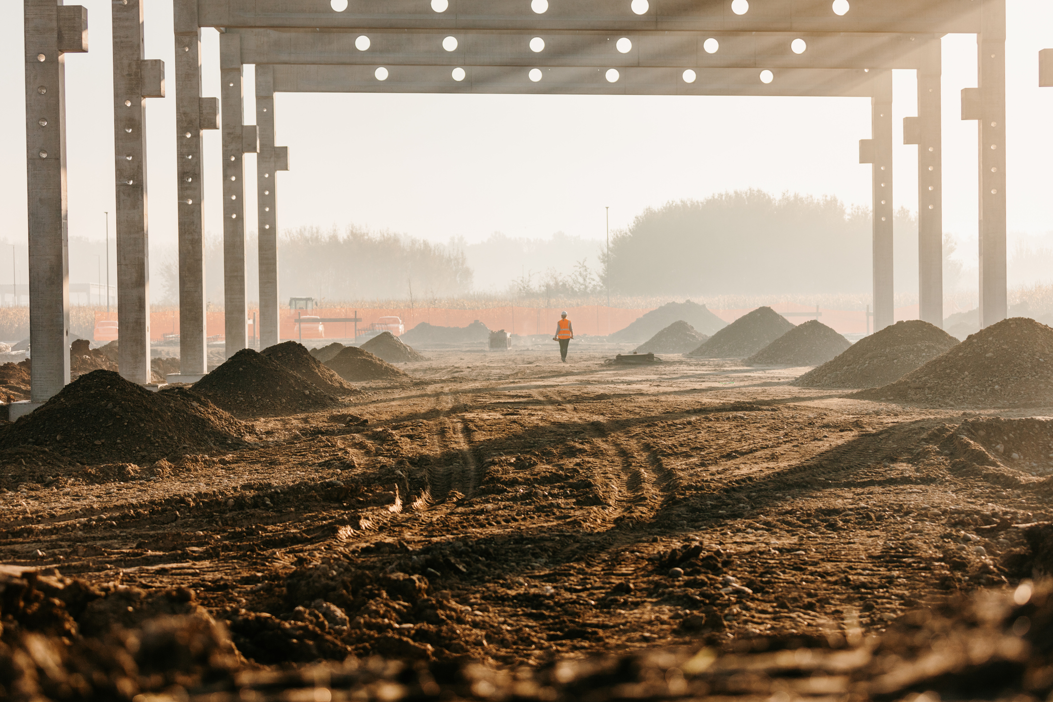 Valley fever can be prevented by taking steps such as preventing construction sites with flying dust. A construction site with dust flying.