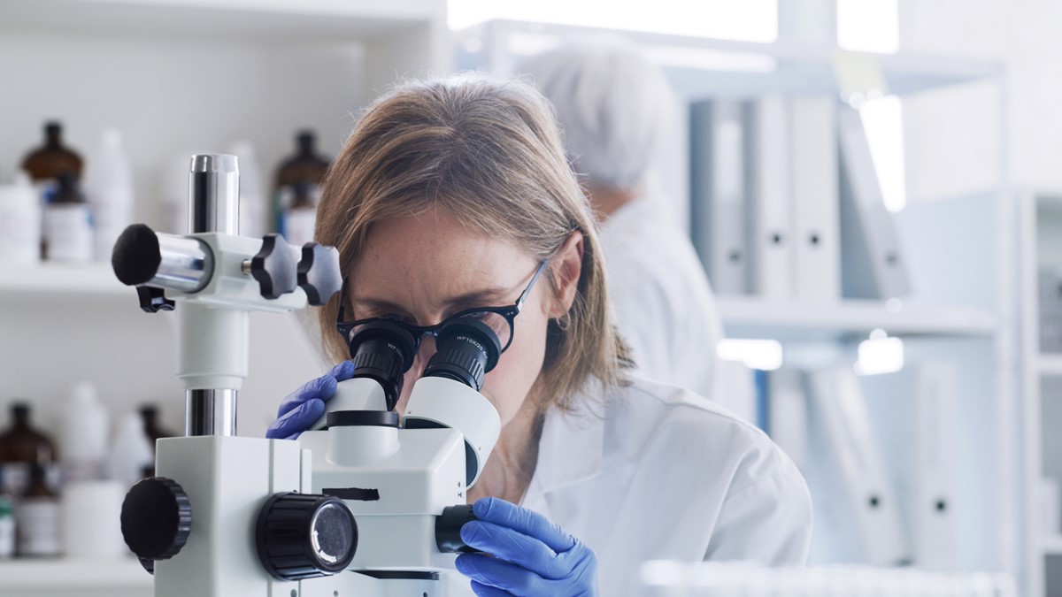 Photo of a researcher using a microscope
