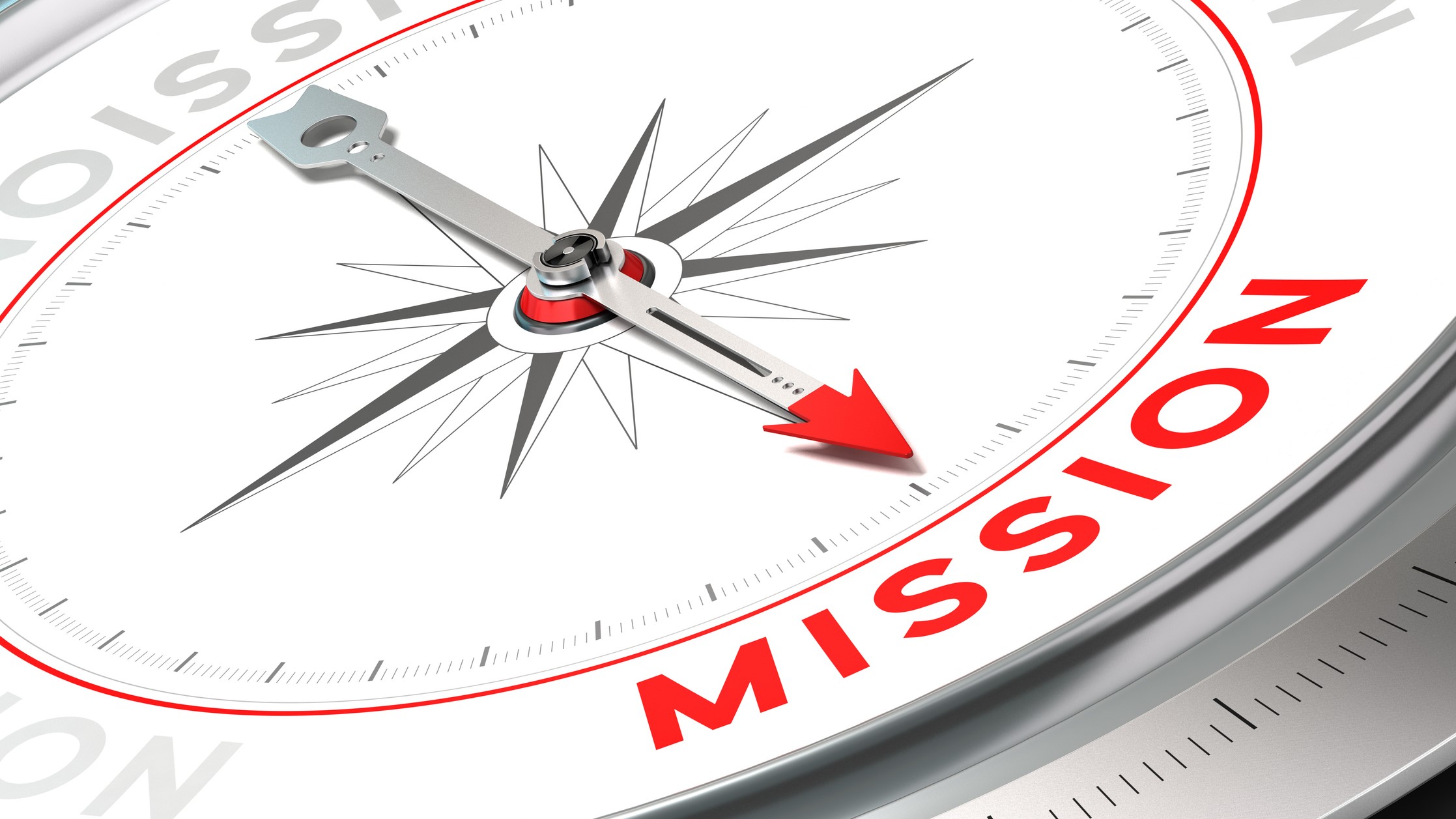 Mission statement revision Closeup photo of a compass with the arrow pointing to the word "Mission."