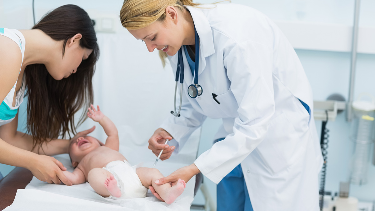 Newborn getting a vitamin K shot Newborn getting a vitamin K shot