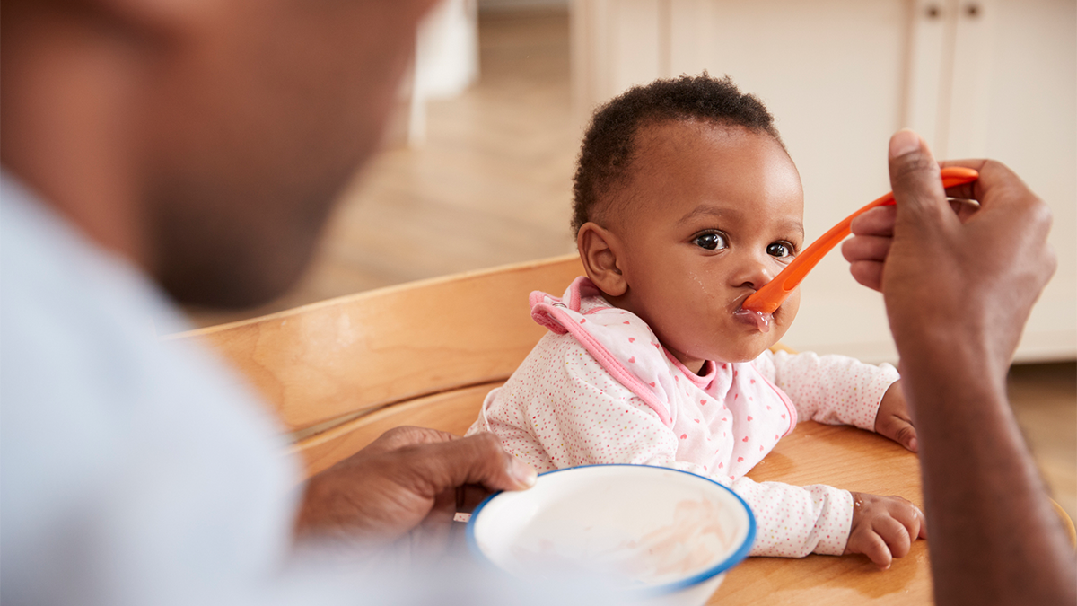 baby eating food off a spoon Baby eating food off a spoon.