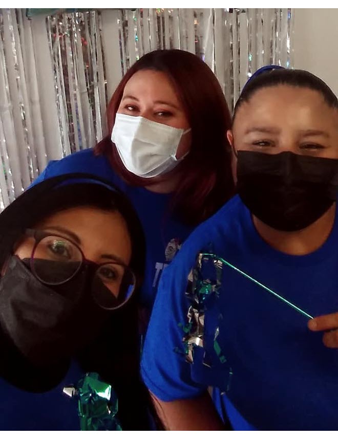 Binational TB Program Los Dos Laredos Dora Aide Martinez, Angeles Hernandez and Salome Ordoñez from "Los Dos Laredos" wearing face masks over mouth and nose